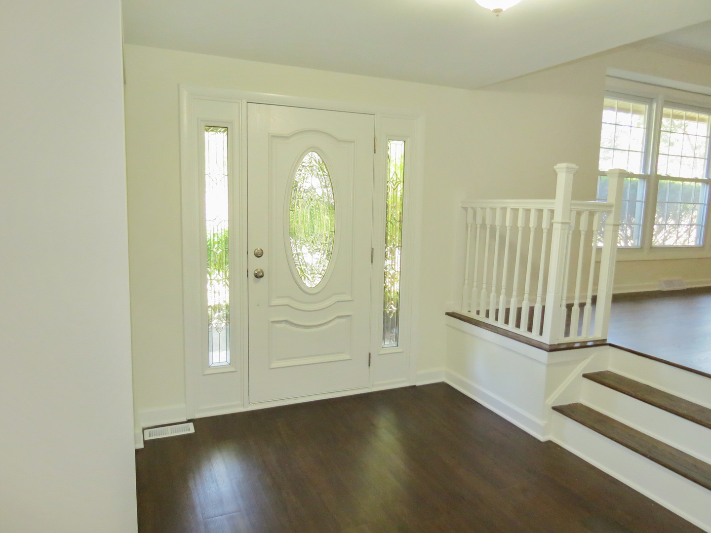 231 Charlotte Lane Bolingbrook, IL 60440 - Photo 3 of 37 an empty room with wooden floor and windows