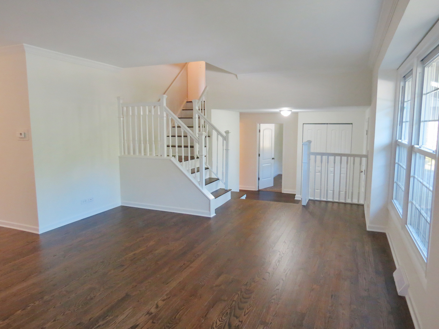231 Charlotte Lane Bolingbrook, IL 60440 - Photo 5 of 37 an empty room with wooden floor and windows
