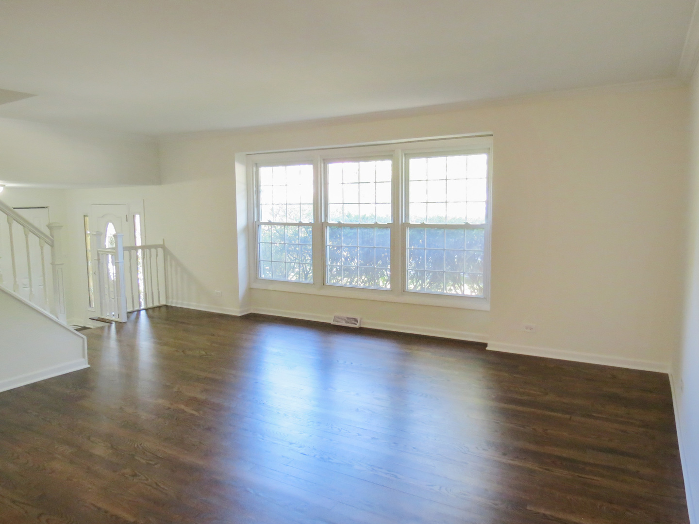 231 Charlotte Lane Bolingbrook, IL 60440 - Photo 7 of 37 wooden floor in an empty room with a window