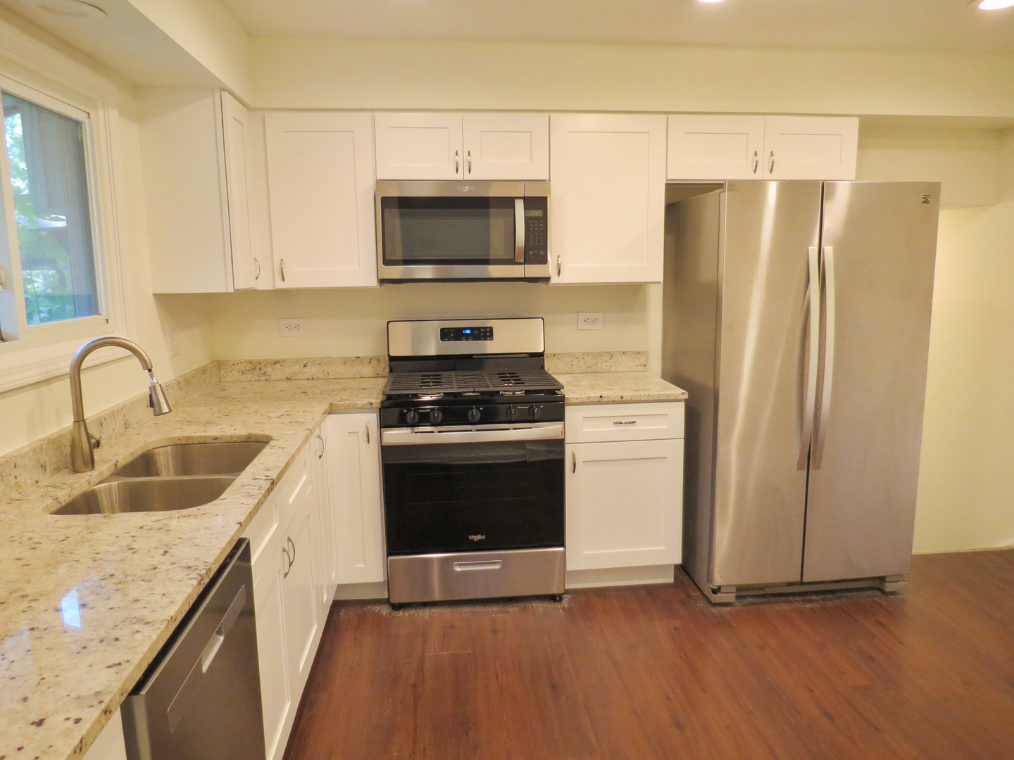 231 Charlotte Lane Bolingbrook, IL 60440 - Photo 9 of 37 a kitchen with a sink stove and refrigerator