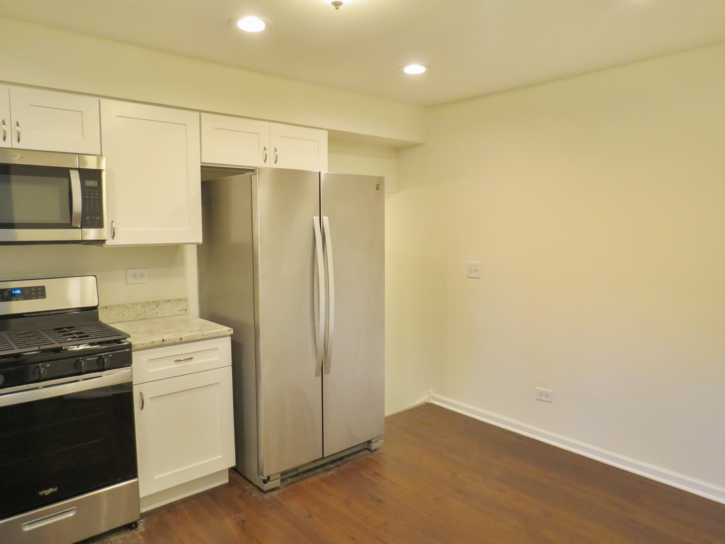 231 Charlotte Lane Bolingbrook, IL 60440 - Photo 10 of 37 a kitchen with a refrigerator stove and microwave