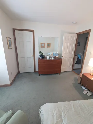 a bed room with a bed and a window