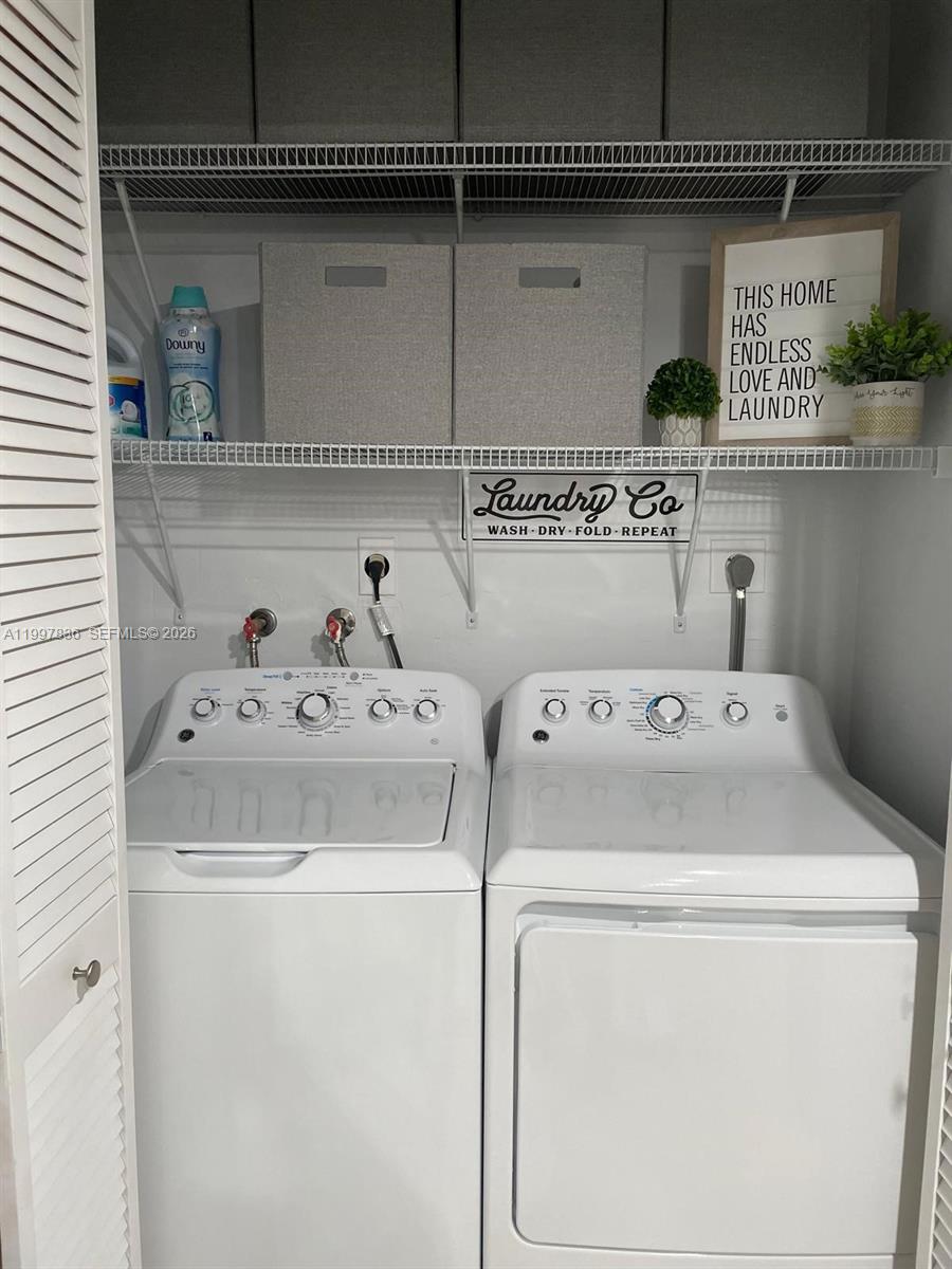 4533 Southwest 143rd Place Miami, FL 33175 - Photo 11 of 12 a utility room with dryer and washer