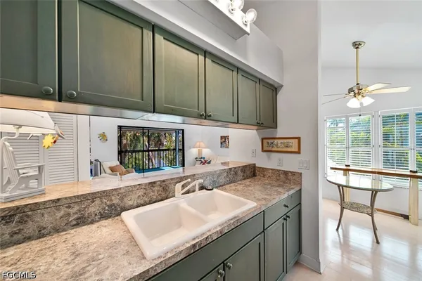 a kitchen with a sink and a refrigerator