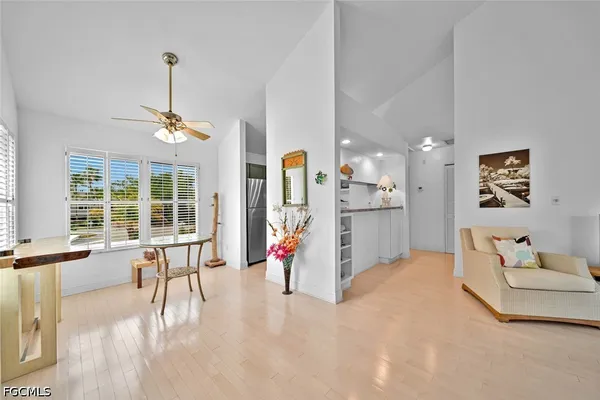 a view of a kitchen with furniture and a chandelier