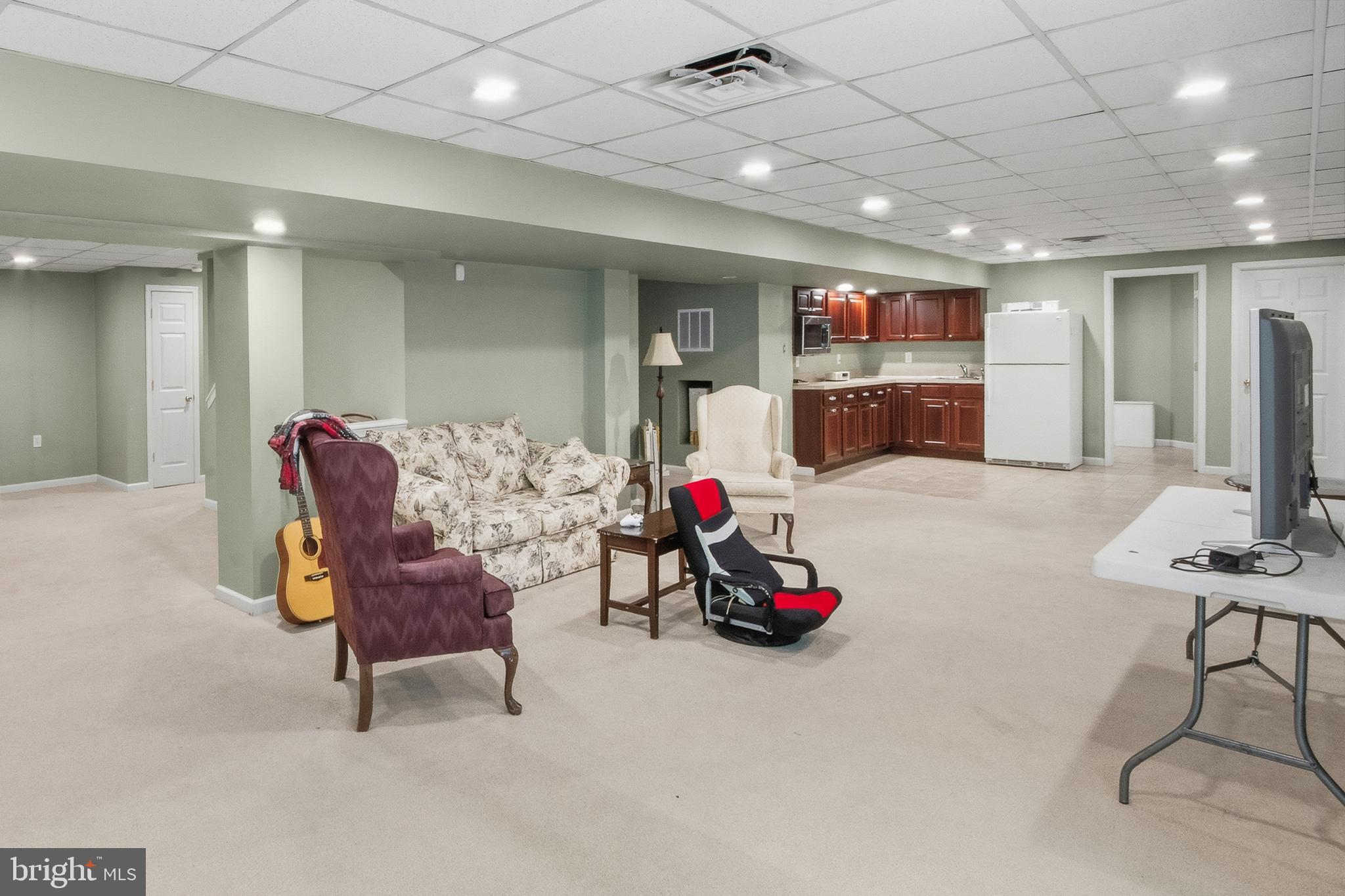15 Hollybrook Road Mullica Hill, NJ 08062 - Photo 5 of 38 a living room with furniture and a flat screen tv