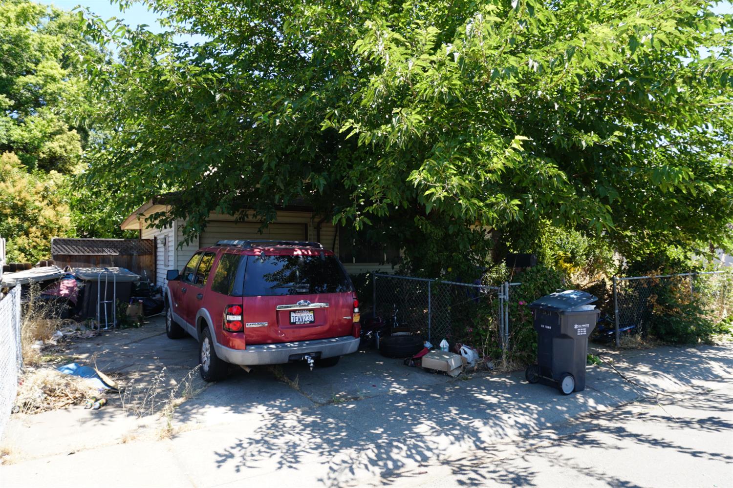 105 Kent Street Galt, CA 95632 - Photo 2 of 3 a backyard of a house with barbeque oven table and chairs