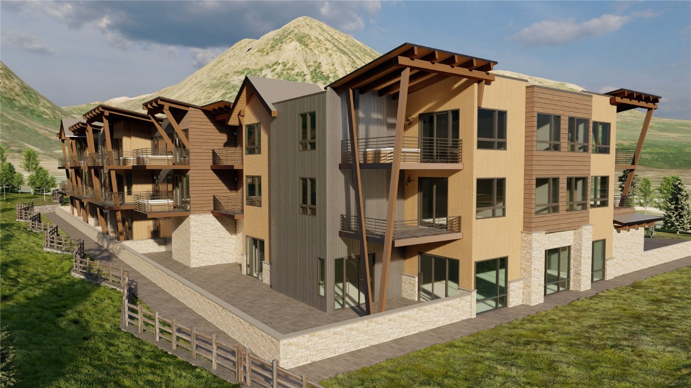 80 West Main Street, Unit 313 Frisco, CO 80443 - Photo 4 of 11 a front view of a residential apartment building with a yard