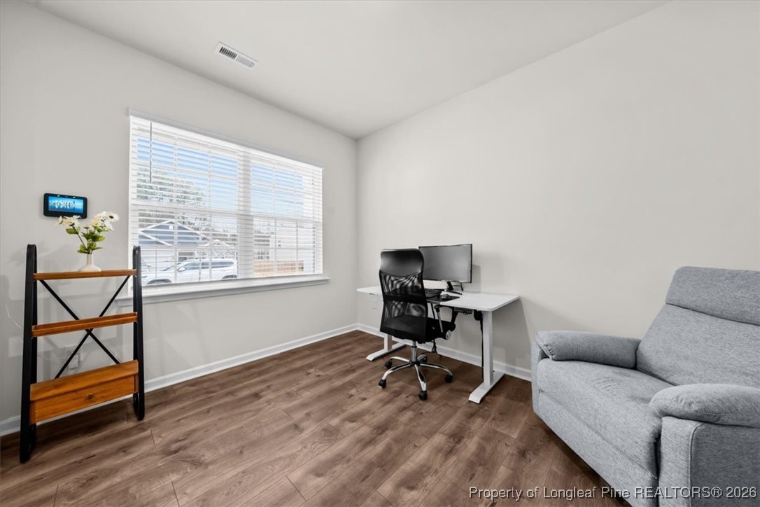 917 Ocean Court Carthage, NC 28327 - Photo 12 of 32 a view of a livingroom with workspace and a window