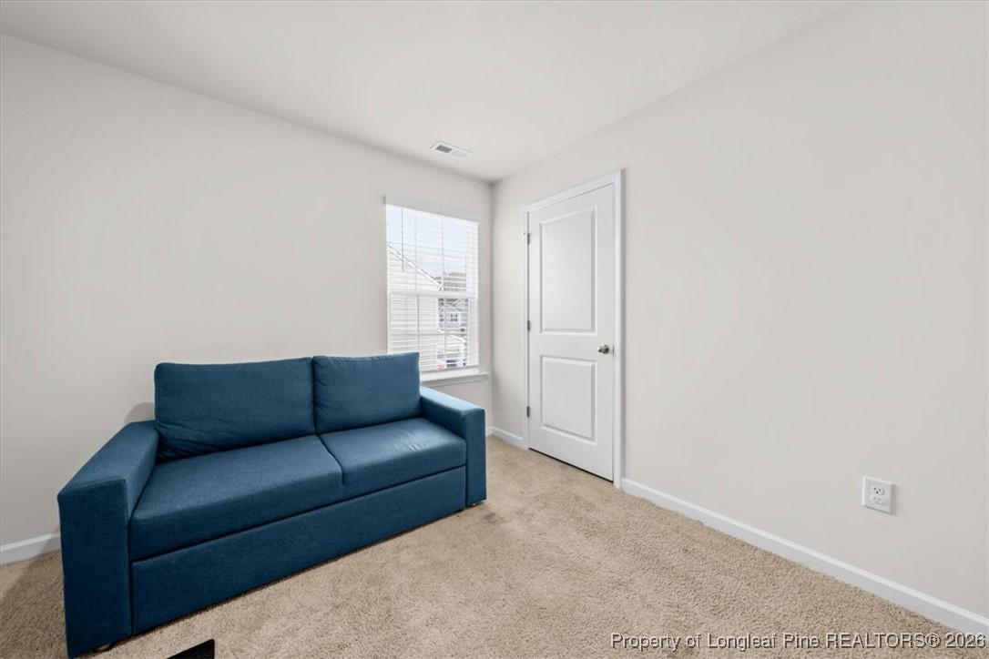 917 Ocean Court Carthage, NC 28327 - Photo 24 of 32 a living room with furniture and a white wall