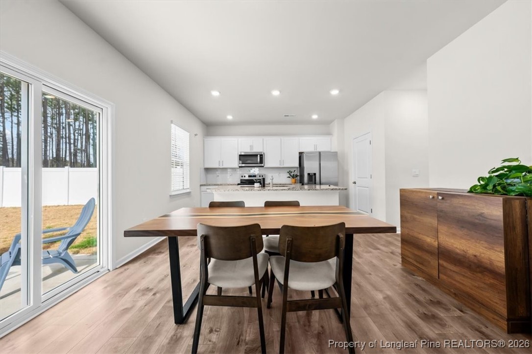 917 Ocean Court Carthage, NC 28327 - Photo 3 of 32 a kitchen with a table and chairs in it