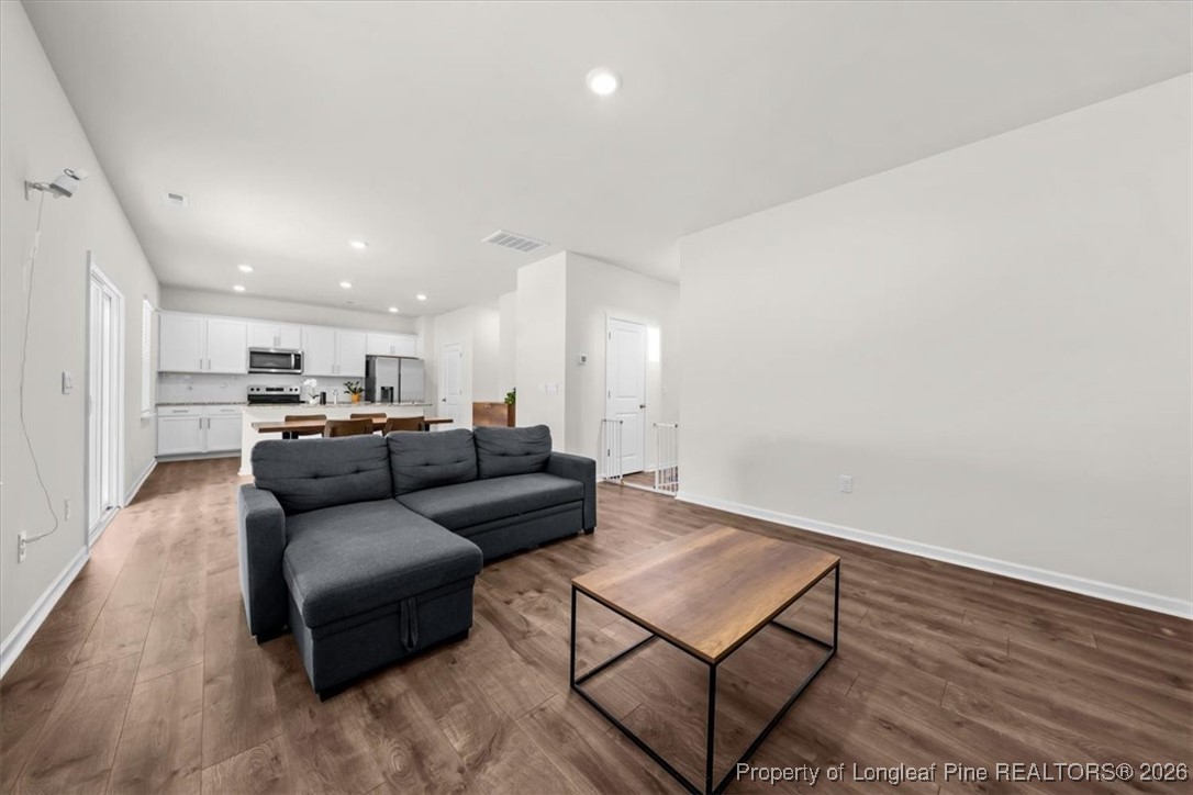 917 Ocean Court Carthage, NC 28327 - Photo 10 of 32 a living room with furniture and a wooden floor