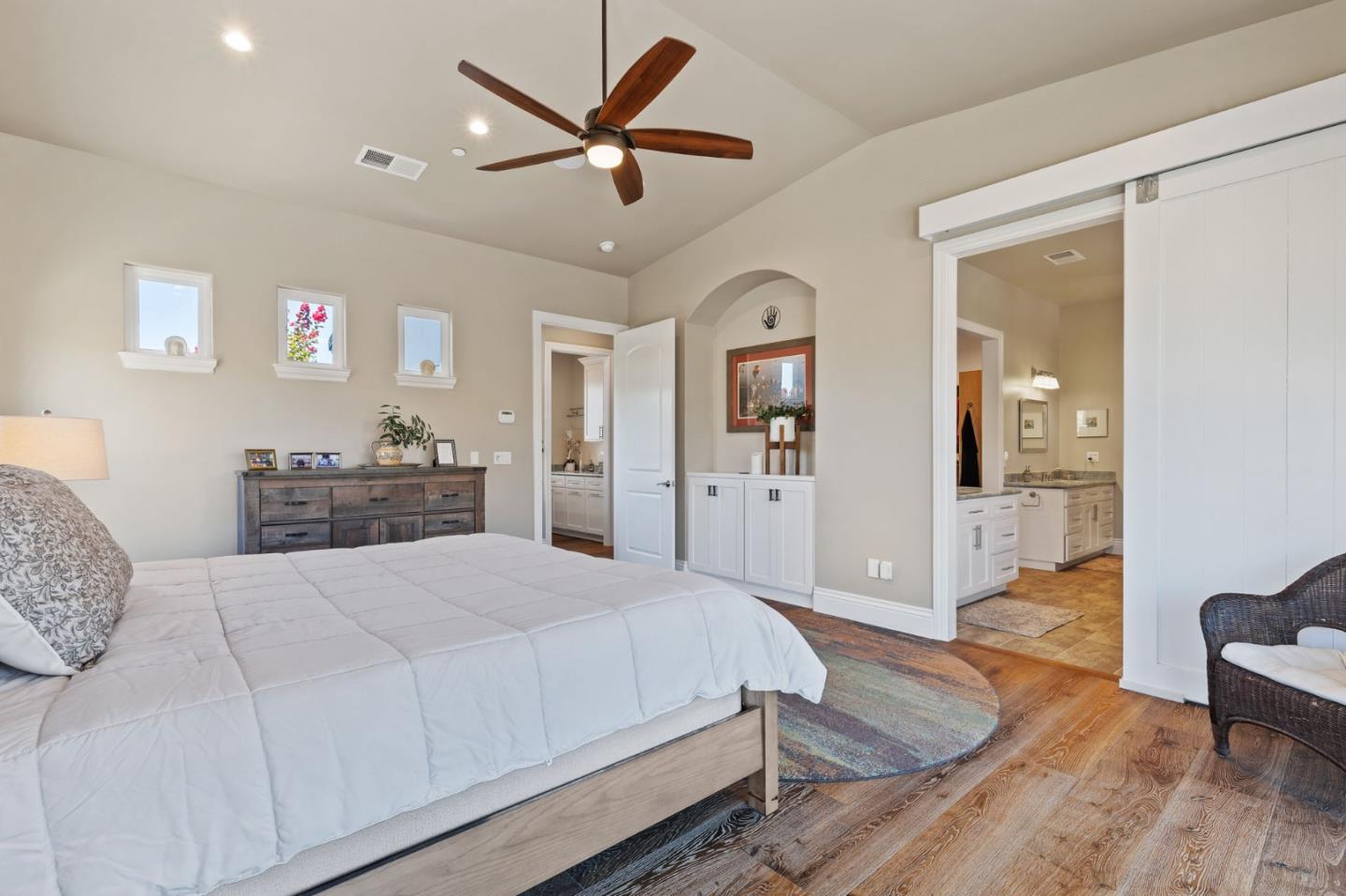 7251 Diablo Hills Road Tres Pinos, CA 95075 - Photo 26 of 60 a bedroom with a large bed and wooden floor