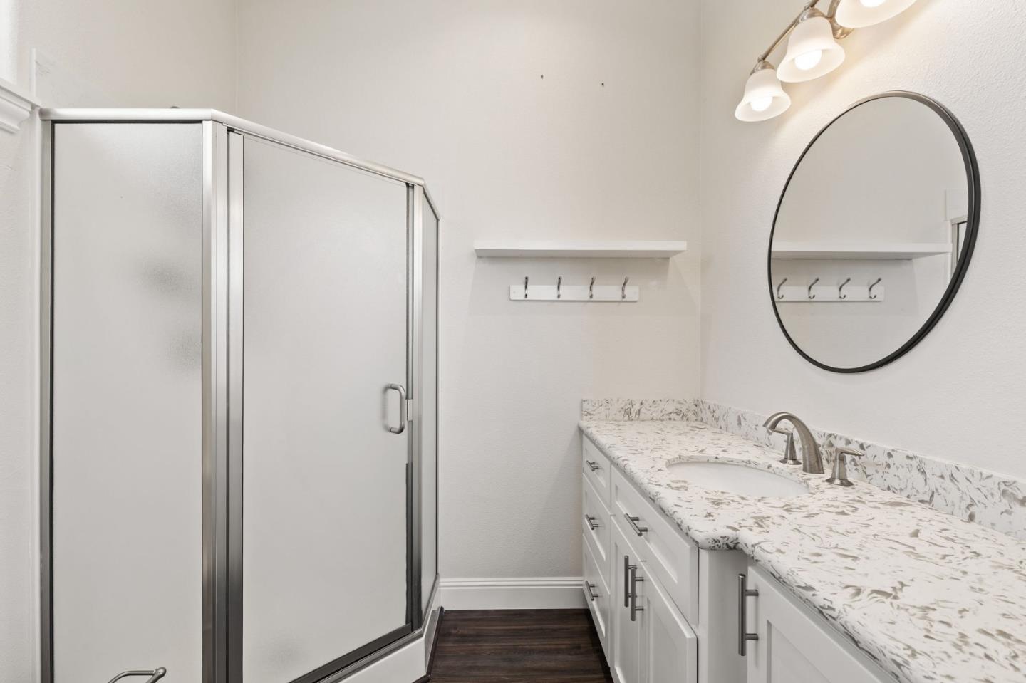 7251 Diablo Hills Road Tres Pinos, CA 95075 - Photo 35 of 60 a bathroom with a granite countertop double vanity sink and a mirror