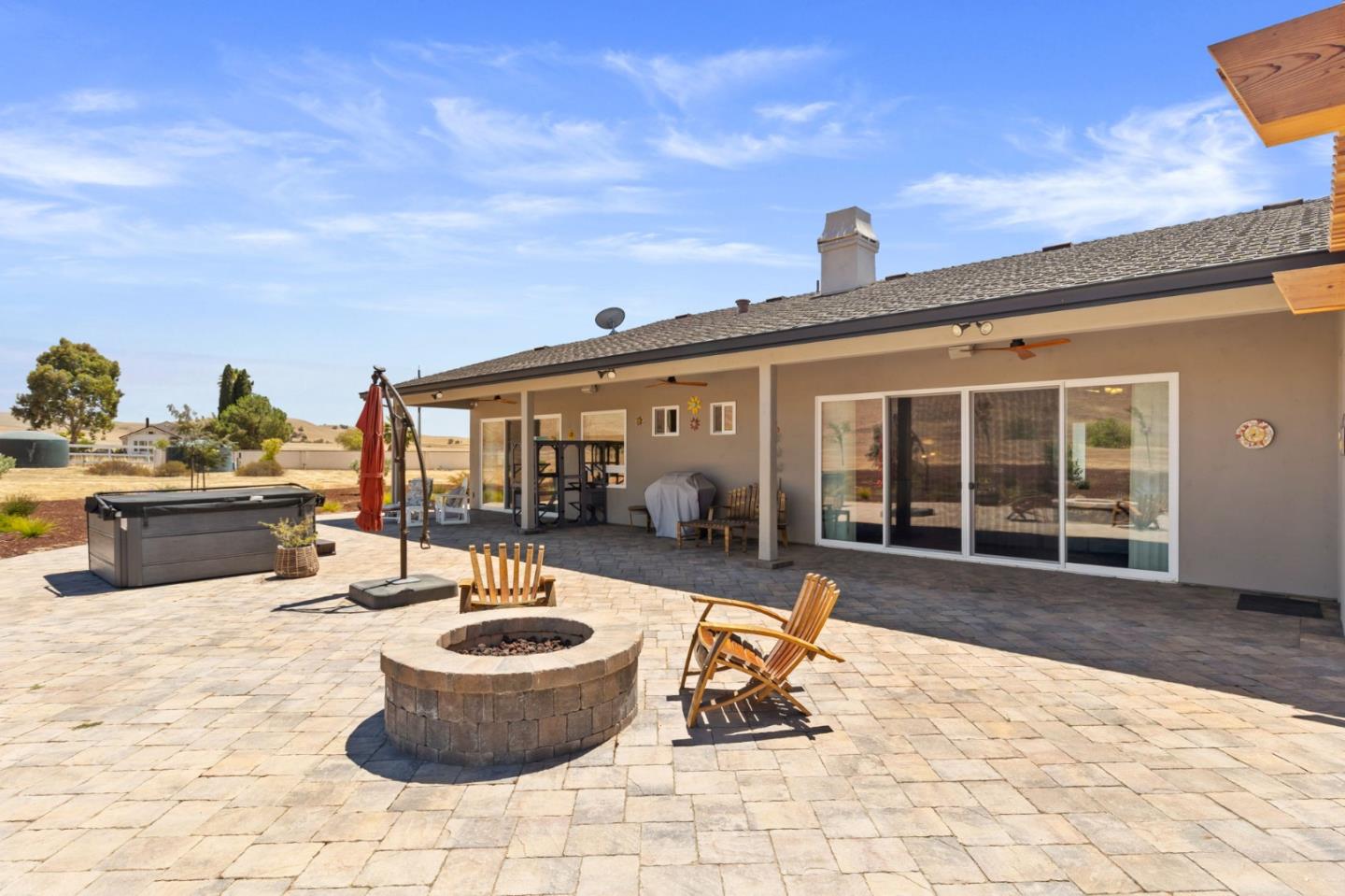 7251 Diablo Hills Road Tres Pinos, CA 95075 - Photo 42 of 60 a view of a patio with a dining table and chairs and potted plants