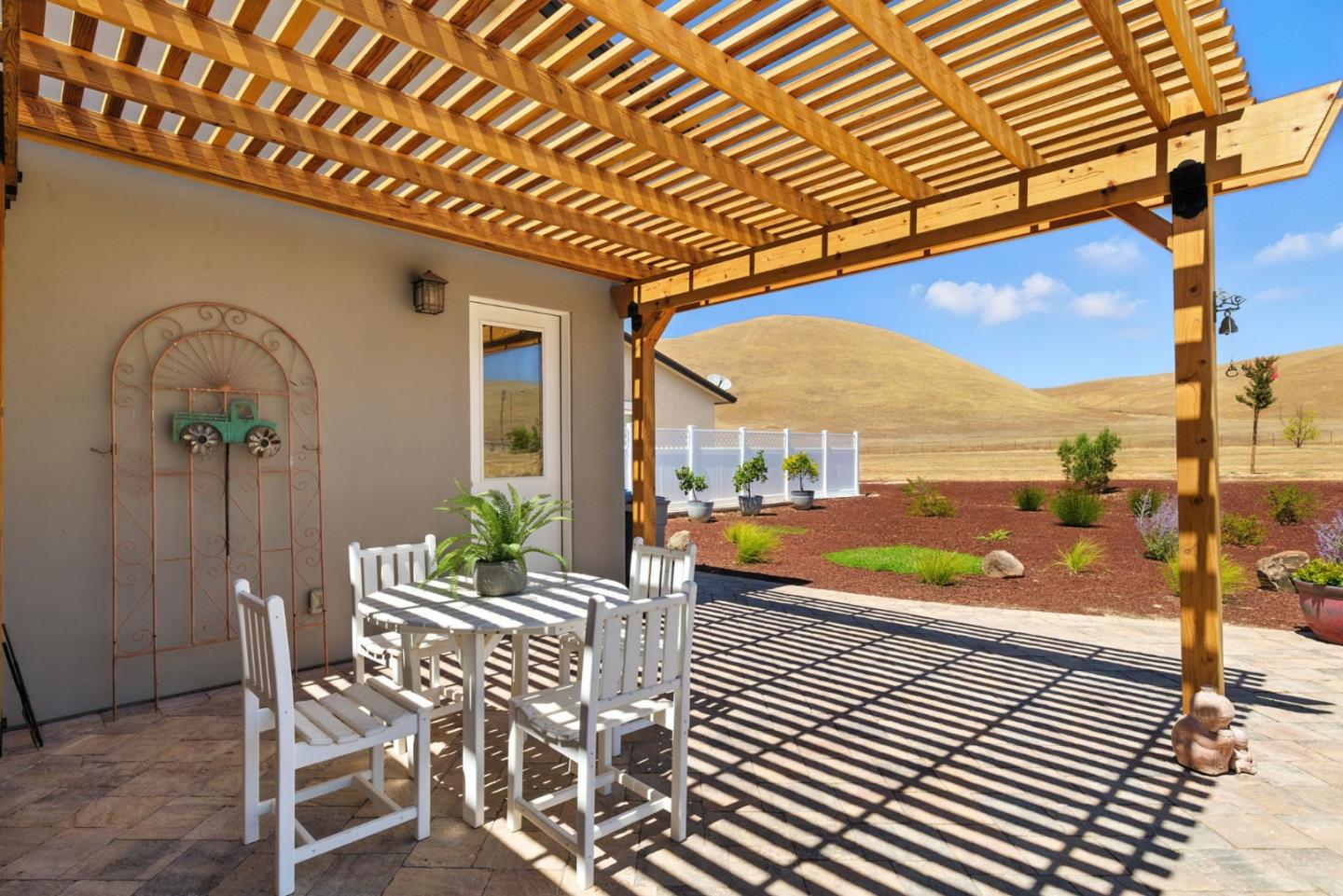 7251 Diablo Hills Road Tres Pinos, CA 95075 - Photo 43 of 60 a patio with glass top table and chairs
