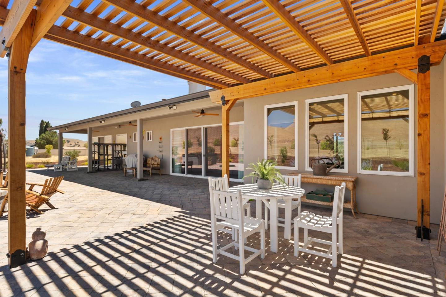 7251 Diablo Hills Road Tres Pinos, CA 95075 - Photo 44 of 60 a view of a patio with table and chairs and potted plants