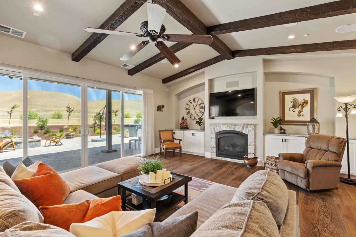 7251 Diablo Hills Road Tres Pinos, CA 95075 - Photo 6 of 60 a living room with furniture a fireplace and a large window