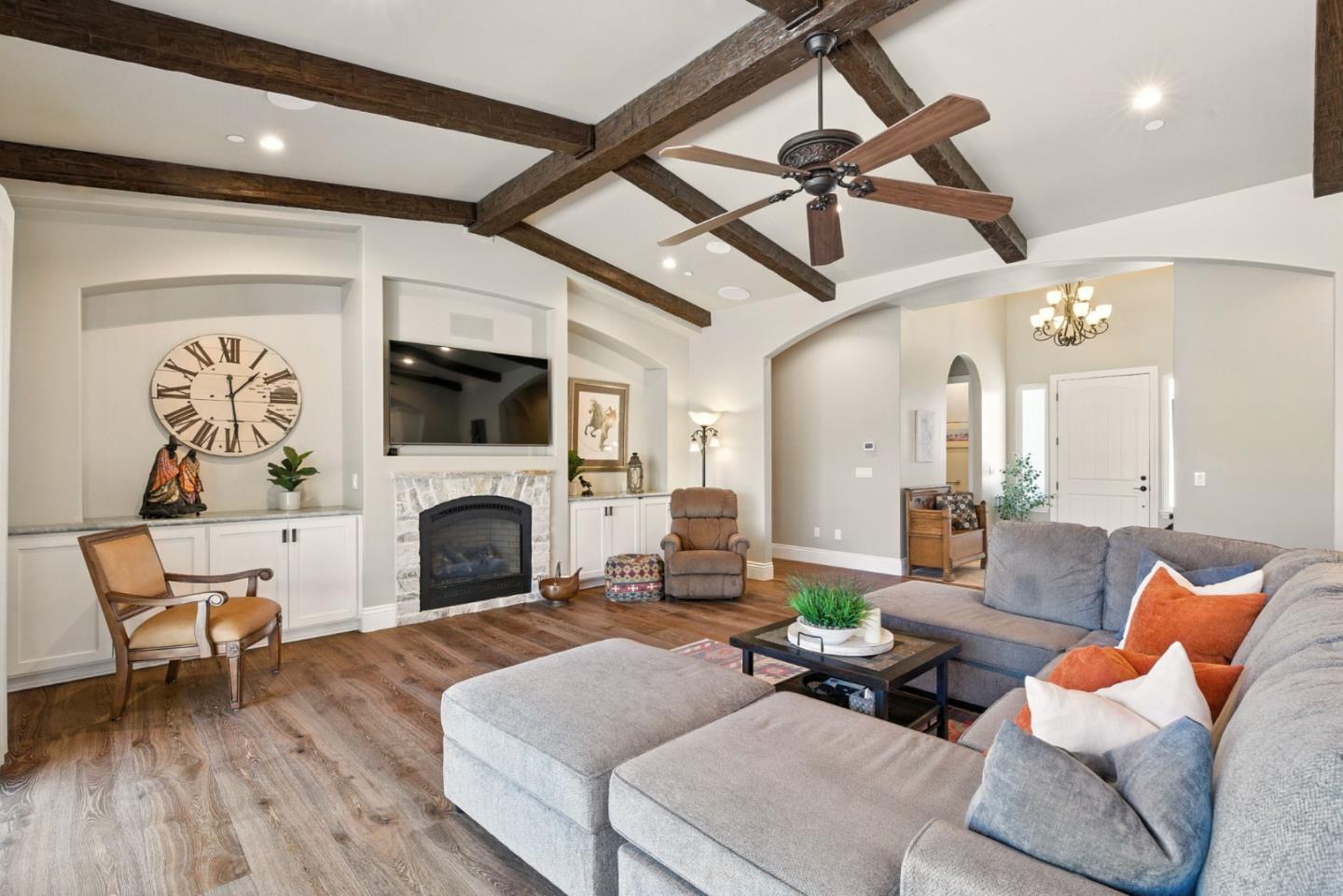 7251 Diablo Hills Road Tres Pinos, CA 95075 - Photo 7 of 60 a living room with furniture a fireplace and a flat screen tv