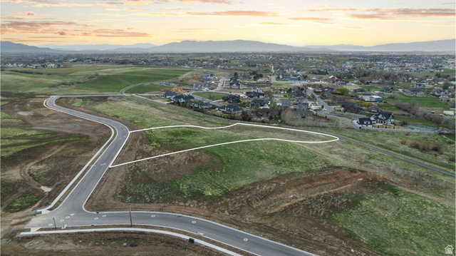 2042 Valley Drive, Unit 57 Mapleton, UT 84664 - Photo 5 of 18 Expansive green space with defined property boundaries, offering a clear development opportunity
