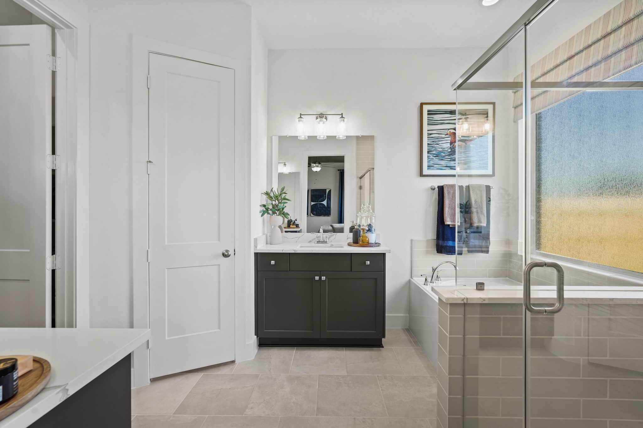 2718 Peach Vly Road Fulshear, TX 77423 - Photo 12 of 45 a bathroom with a bathtub sink and mirror