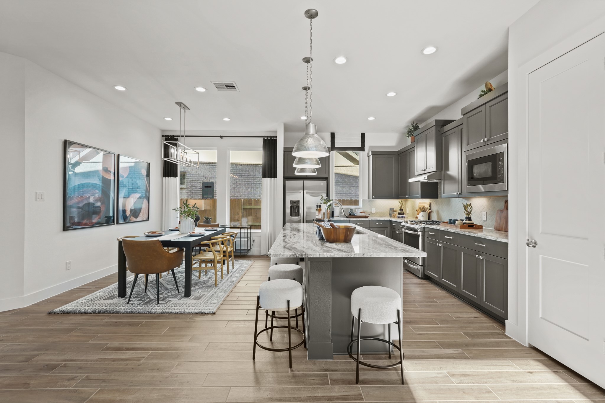 2718 Peach Vly Road Fulshear, TX 77423 - Photo 20 of 45 a large kitchen with a table and chairs