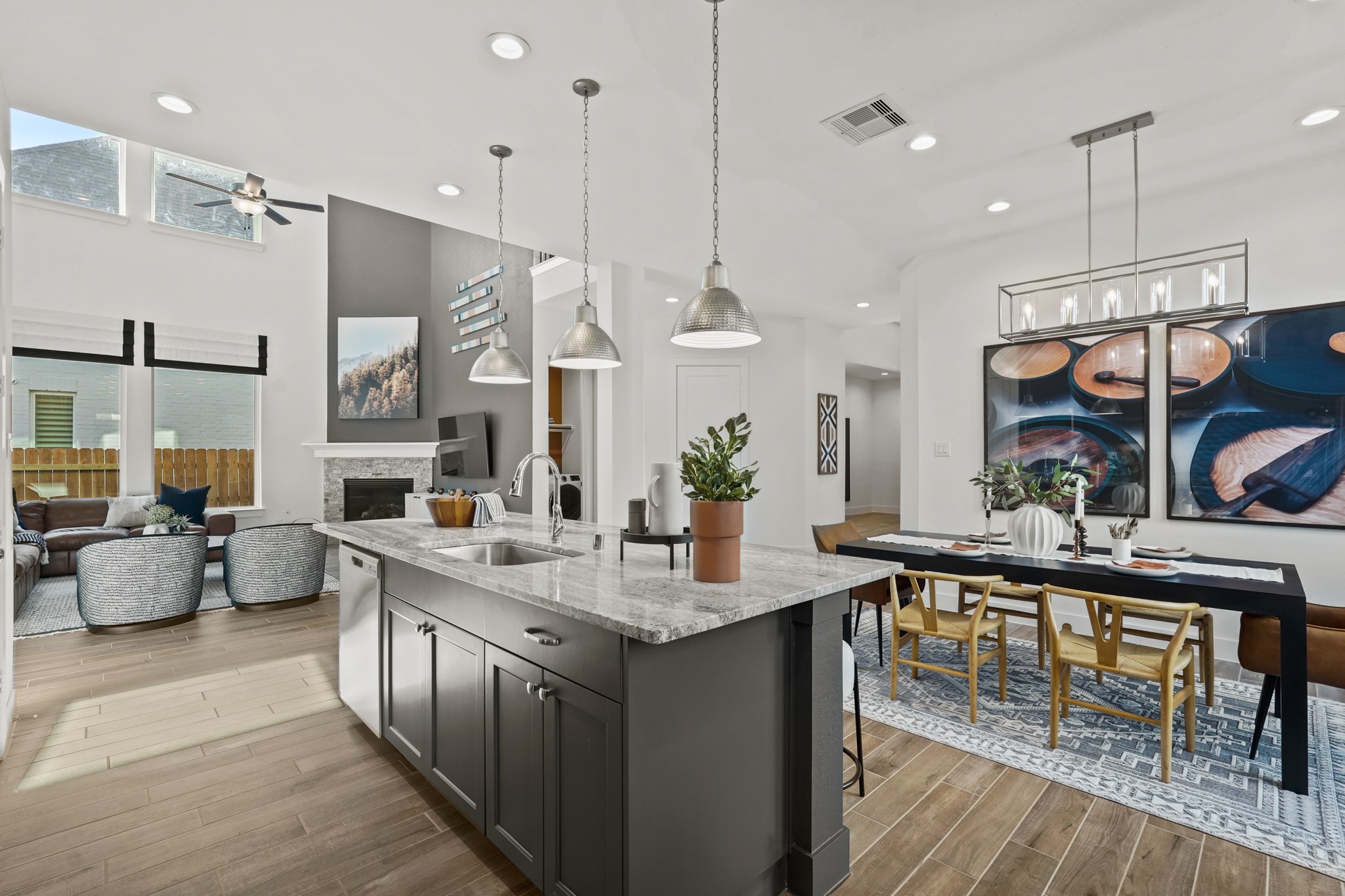 2718 Peach Vly Road Fulshear, TX 77423 - Photo 23 of 45 a kitchen with stainless steel appliances granite countertop a sink a stove and a wooden floors