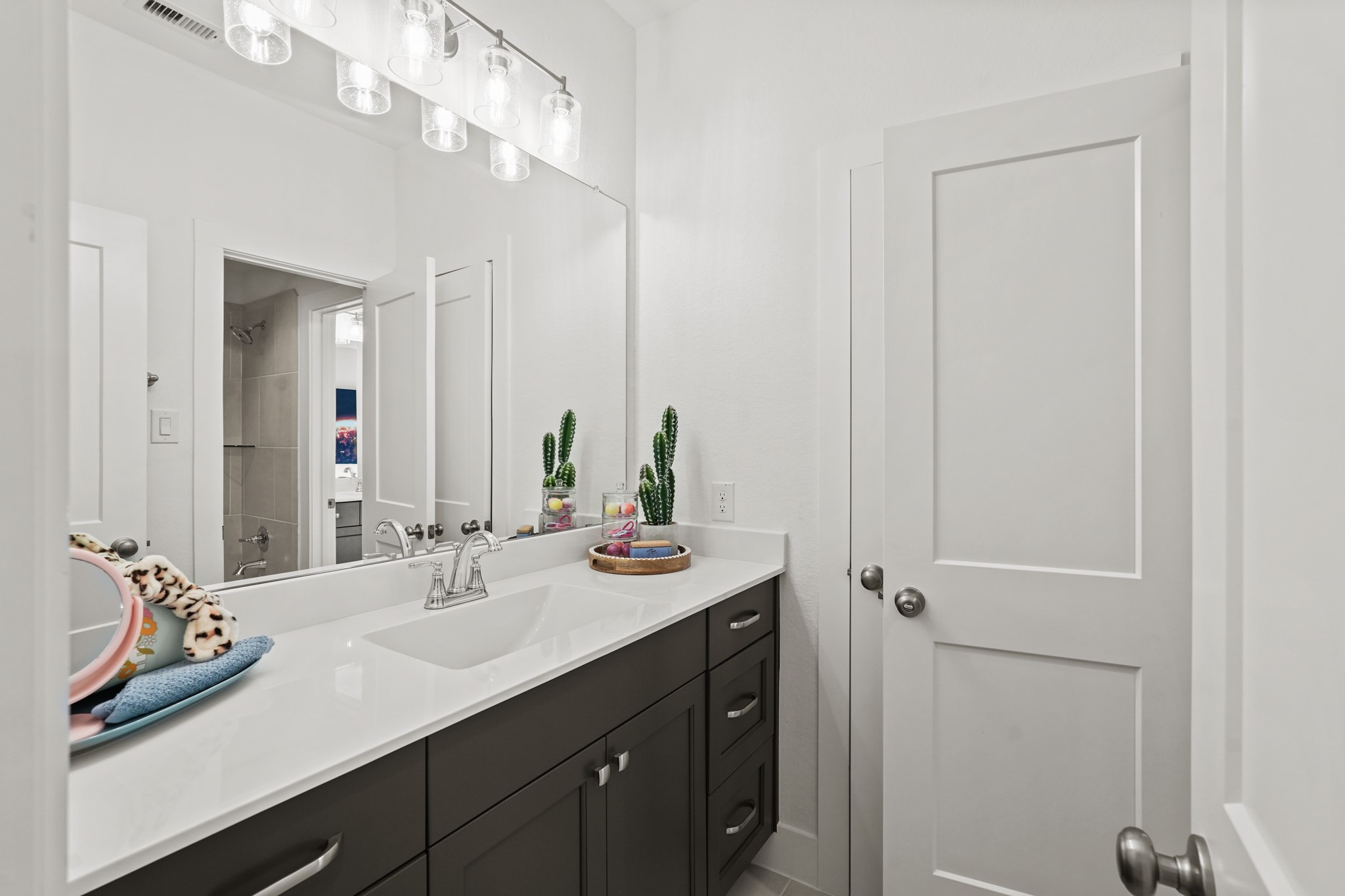 2718 Peach Vly Road Fulshear, TX 77423 - Photo 30 of 45 a bathroom with a sink a vanity and a mirror