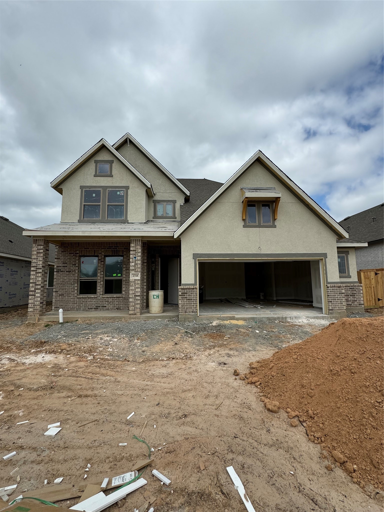 2718 Peach Vly Road Fulshear, TX 77423 - Photo 41 of 45 a front view of a house with a yard and garage