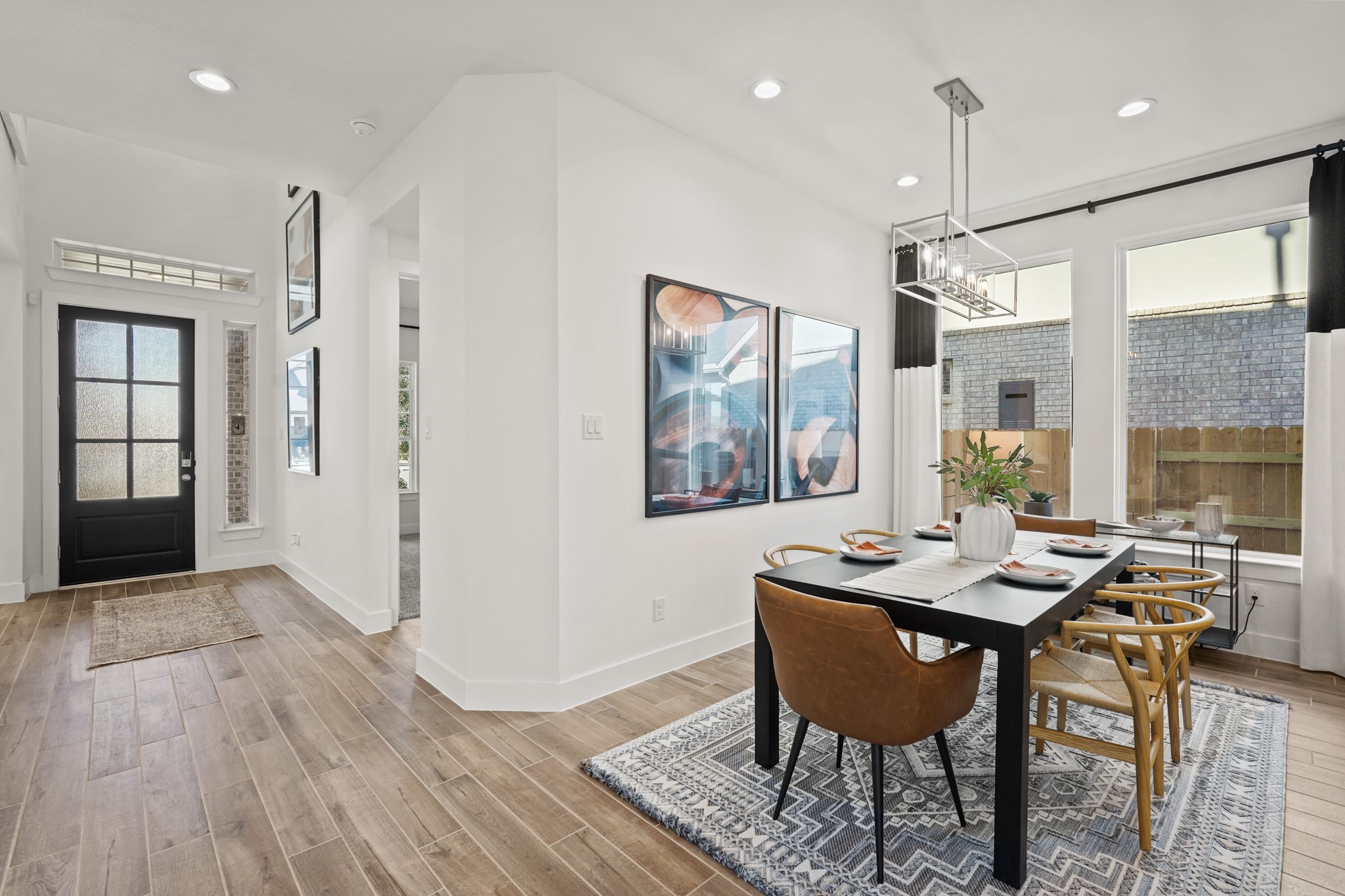 2718 Peach Vly Road Fulshear, TX 77423 - Photo 7 of 45 a view of a dining room with furniture window and wooden floor