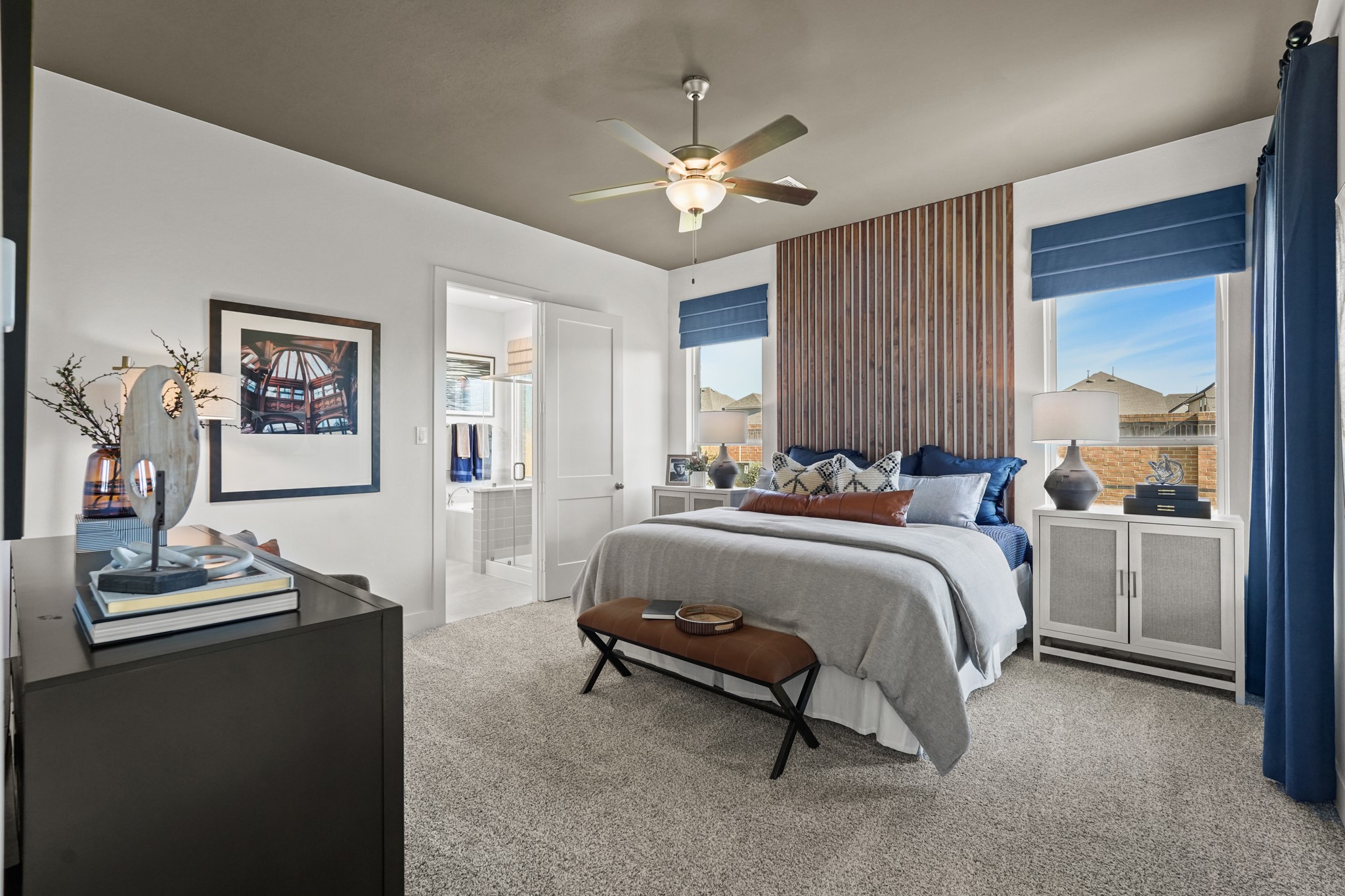 2718 Peach Vly Road Fulshear, TX 77423 - Photo 9 of 45 a spacious bedroom with a bed and a chandelier