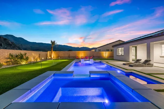 a view of grassy field with mountain