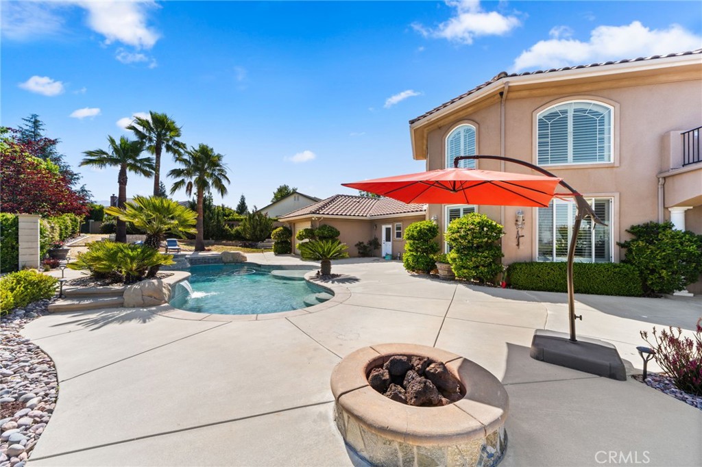 38136 Butterfly Court Yucaipa, CA 92399 - Photo 20 of 71 a swimming pool with outdoor seating and yard