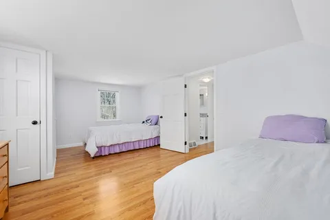 a bedroom with a bed and a closet