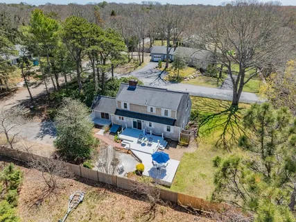 an aerial view of residential houses with outdoor space