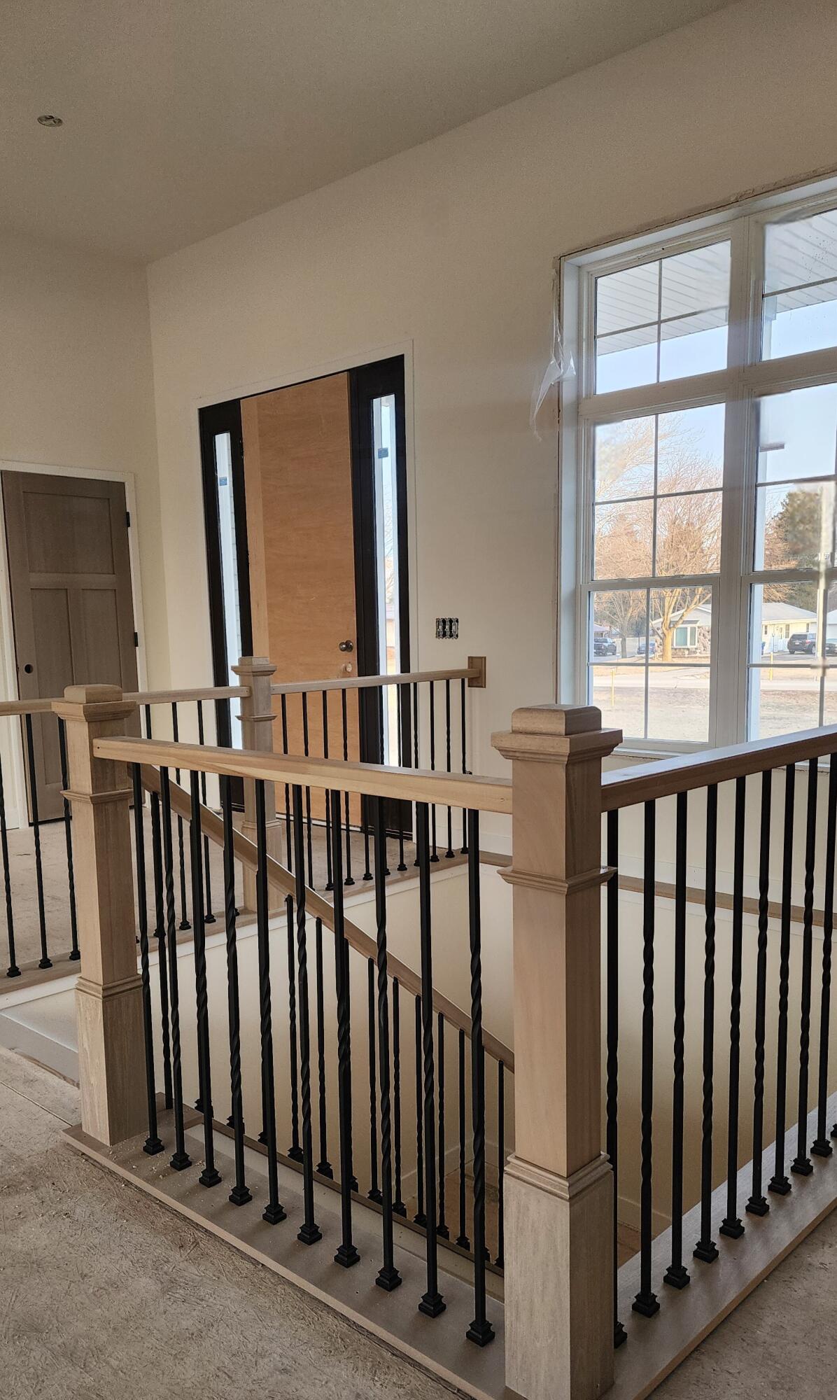 2161 Wallace Lake Road, Unit LT10 Trenton, WI 53090 - Photo 3 of 14 Stunning railings and stairs to the Exposed lower level with Tall Ceilings perfect for future additional entertainment space