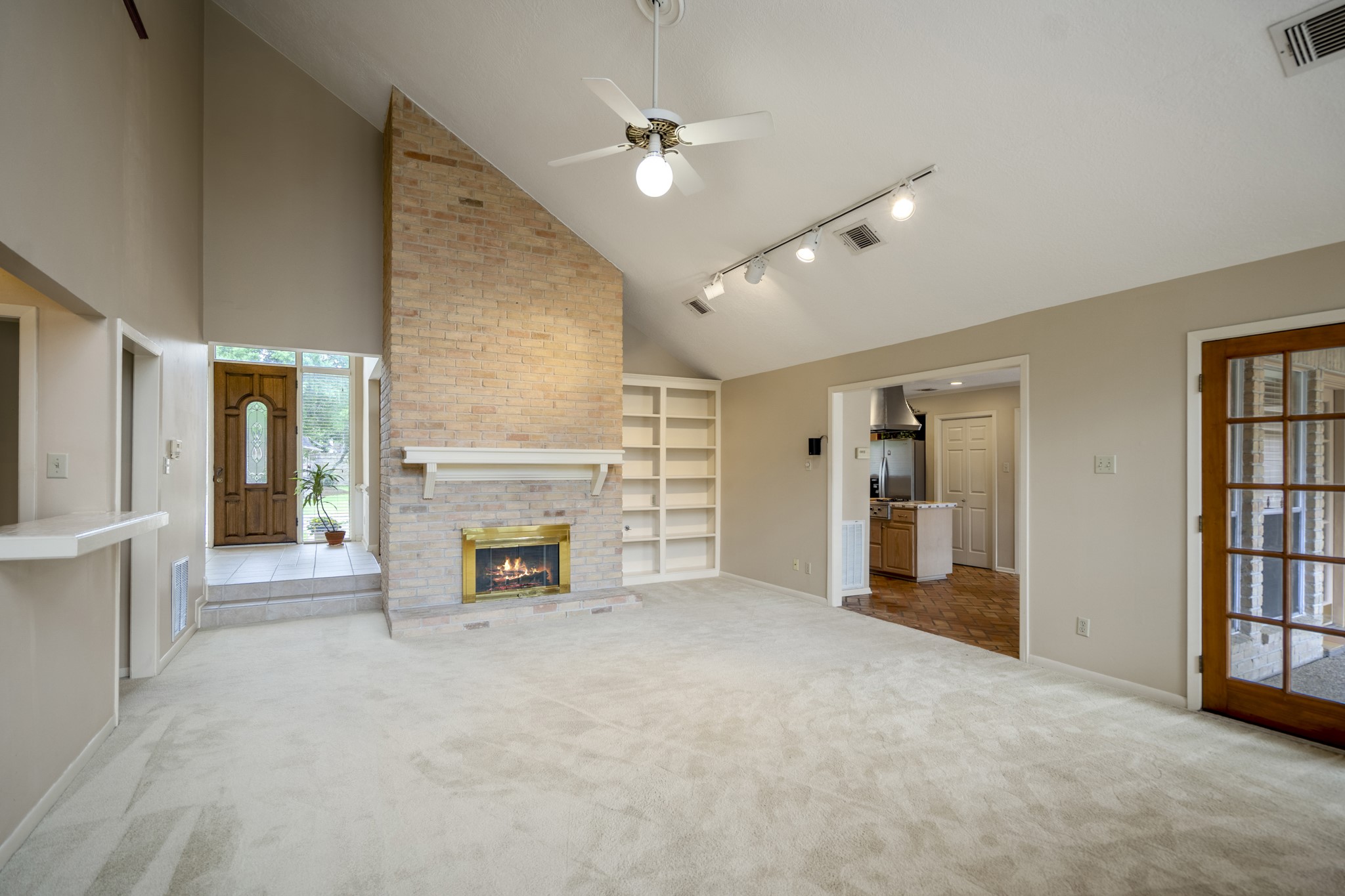 16606 Brendon Court Spring, TX 77379 - Photo 13 of 43 The family room / den area offers built-ins next to the fireplace, lots of light from all angles and easy access to the backyard.
