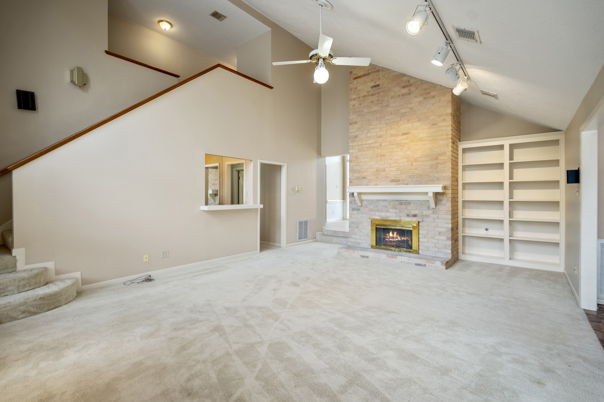 16606 Brendon Court Spring, TX 77379 - Photo 16 of 43 The family room is large and offers an abundnce of natural light. The space has an angled ceiling for architectural interest.
