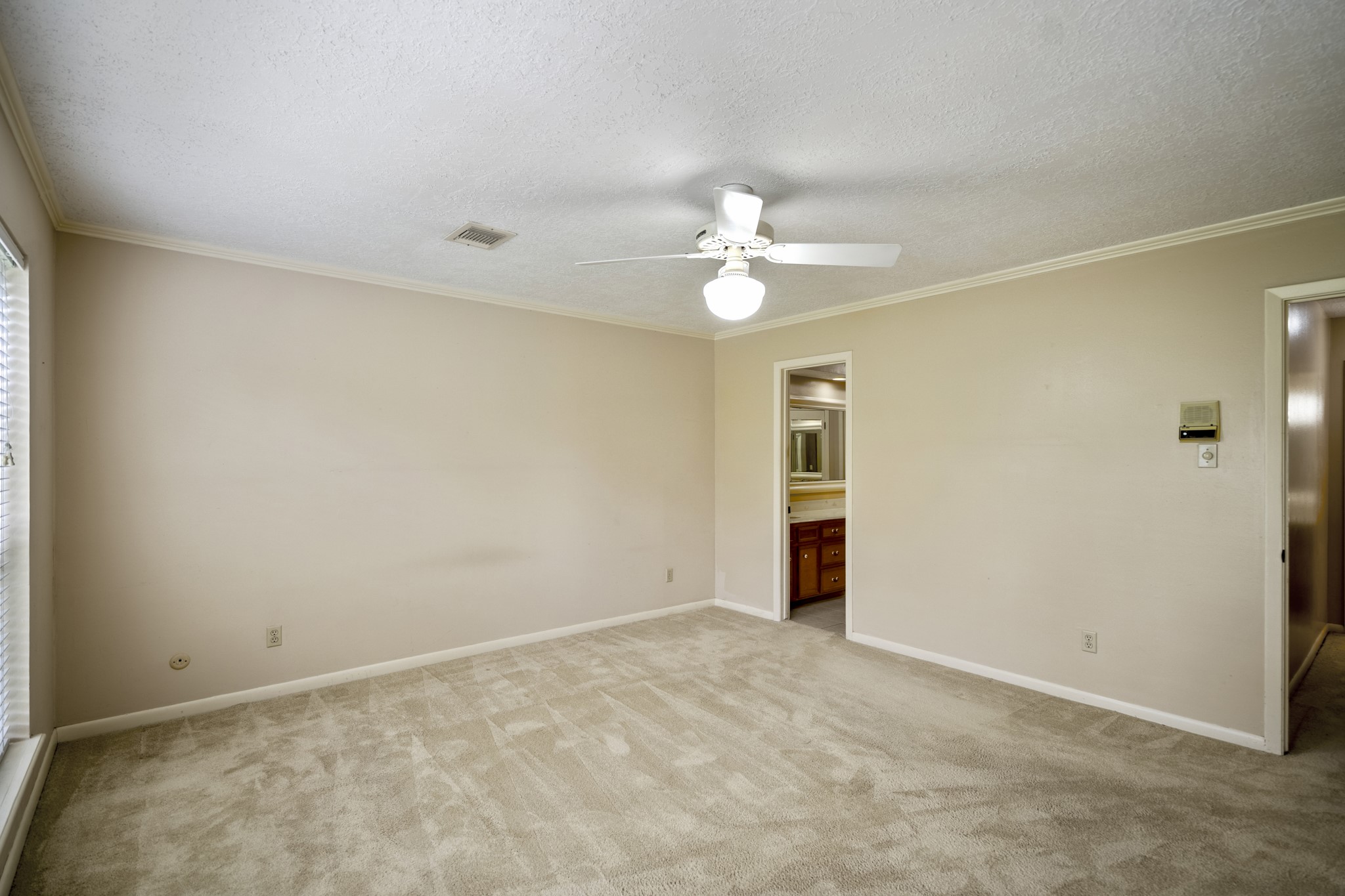 16606 Brendon Court Spring, TX 77379 - Photo 27 of 43 Here is an opposite view of the primary suite with access to the en-suite bathroom.