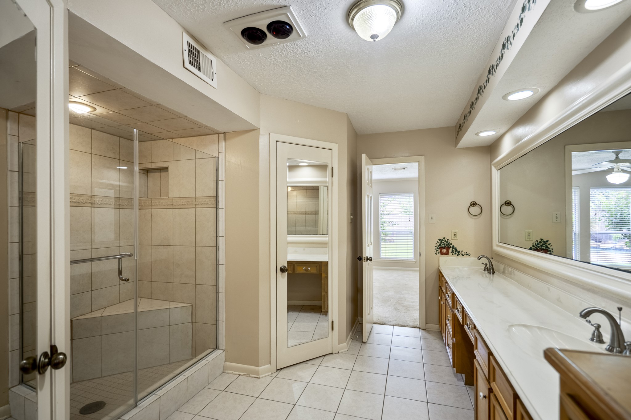 16606 Brendon Court Spring, TX 77379 - Photo 30 of 43 The en-suite bathroom has dual sinks with a vanity area that separates the two sinks.