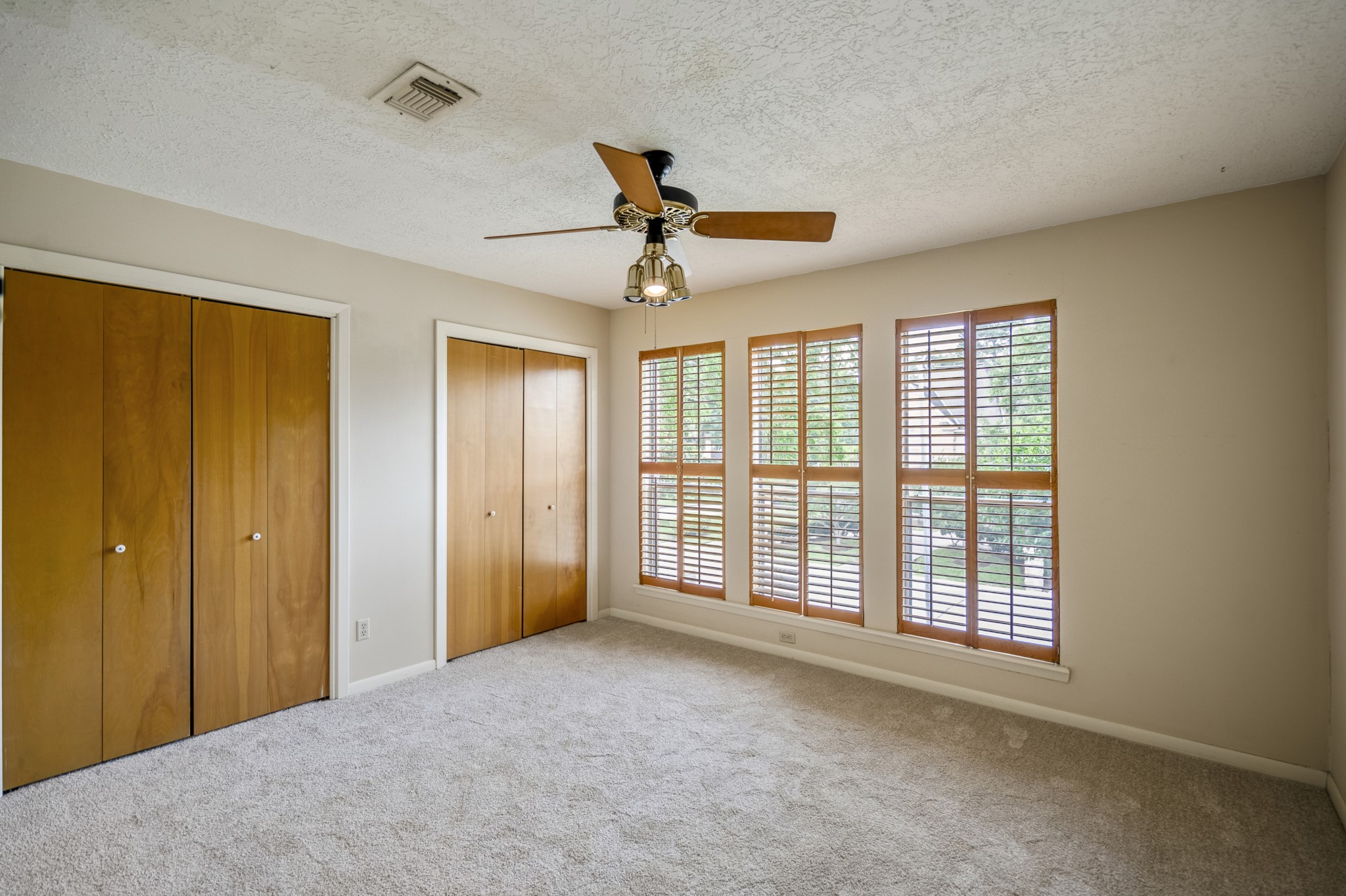16606 Brendon Court Spring, TX 77379 - Photo 32 of 43 This is the third bedroom upstairs which has 3 large windows, and nice sized closets, could be an ideal guest suite.