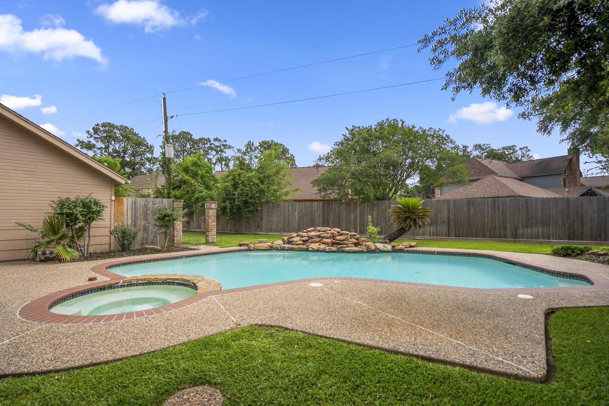 16606 Brendon Court Spring, TX 77379 - Photo 37 of 43 This backyard offers a lifestyle of relaxation and year-round entertainment with an expansive decking that provides a clean, durable, and sophisticated surface for lounging.