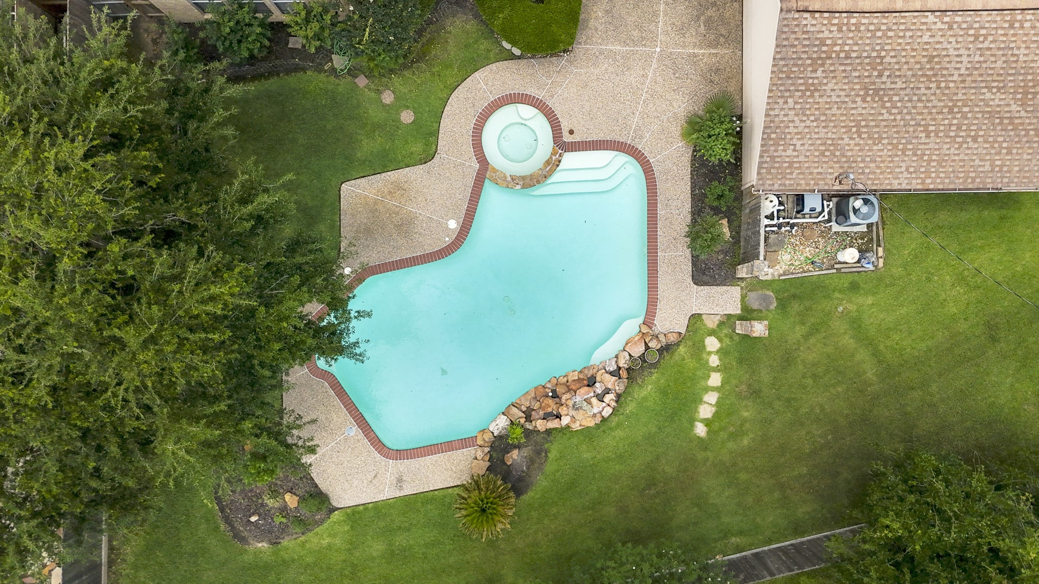16606 Brendon Court Spring, TX 77379 - Photo 38 of 43 An aerial view of the backyard, showing how the pool is situated, where is maximizes the one area without compromising the grassy area of the backyard.