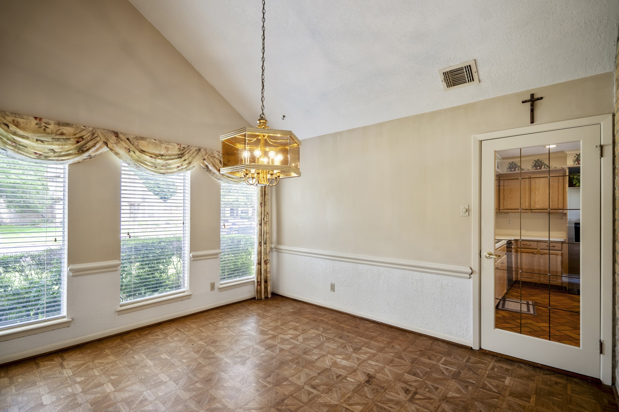 16606 Brendon Court Spring, TX 77379 - Photo 10 of 43 The formal dining room has neutral colors, offers a glass door to the kitchen which is ideal when hosting parties.