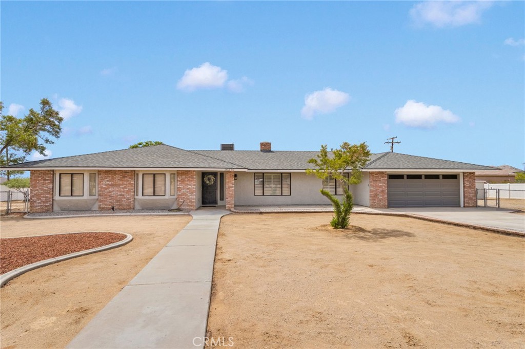 a front view of a house with yard