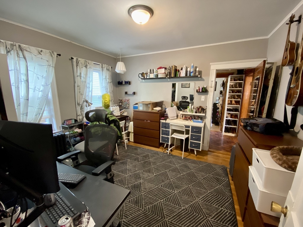12 St Peter Street, Unit 1 Boston, MA 02130 - Photo 12 of 20 a work room with furniture a rug and a window