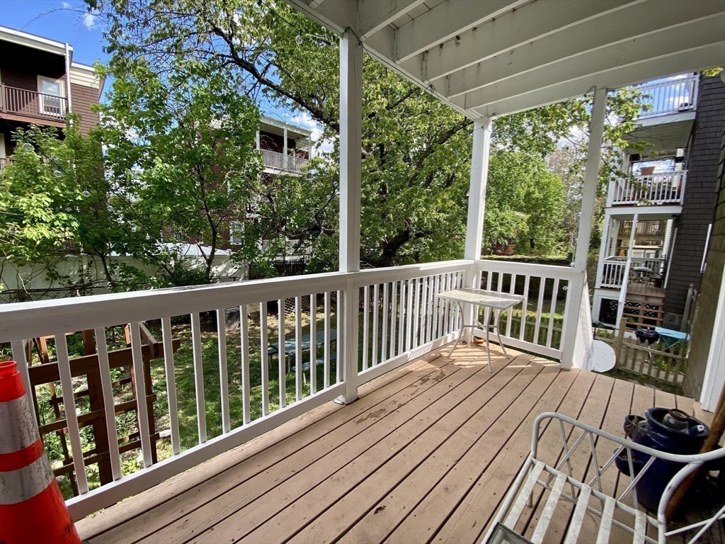 12 St Peter Street, Unit 1 Boston, MA 02130 - Photo 15 of 20 a view of a wooden deck with a yard