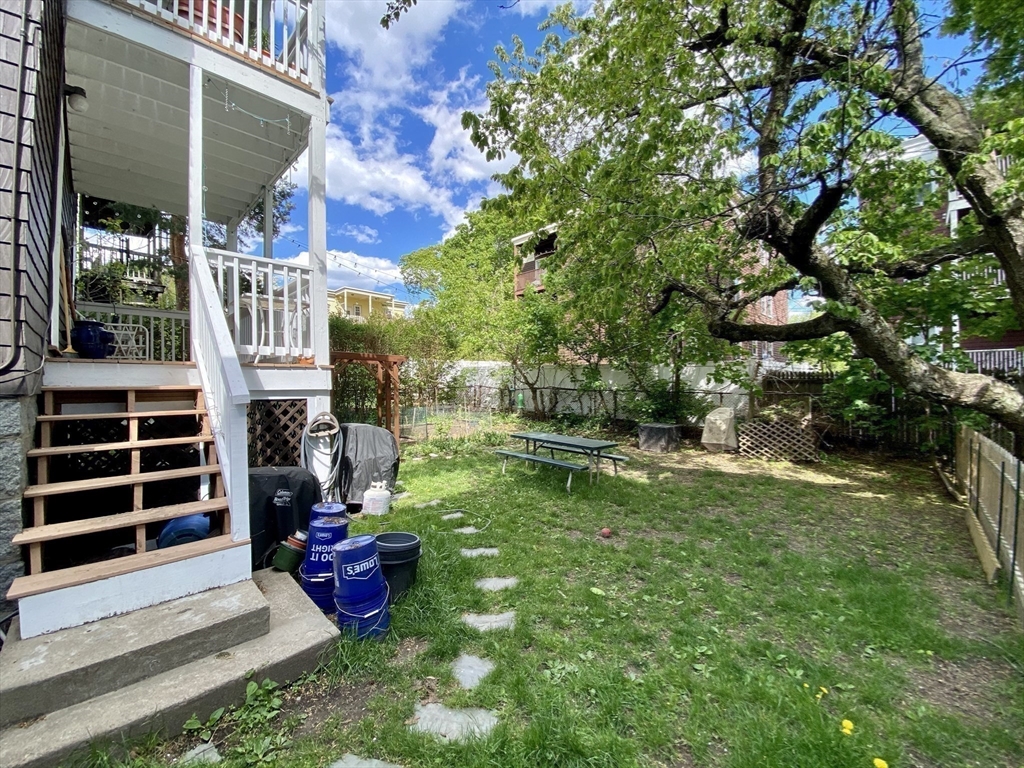 12 St Peter Street, Unit 1 Boston, MA 02130 - Photo 16 of 20 a view of a chair and table in backyard of the house