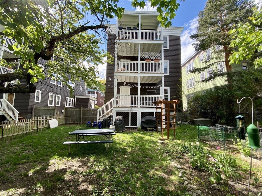 12 St Peter Street, Unit 1 Boston, MA 02130 - Photo 18 of 20 two view of a house with a yard