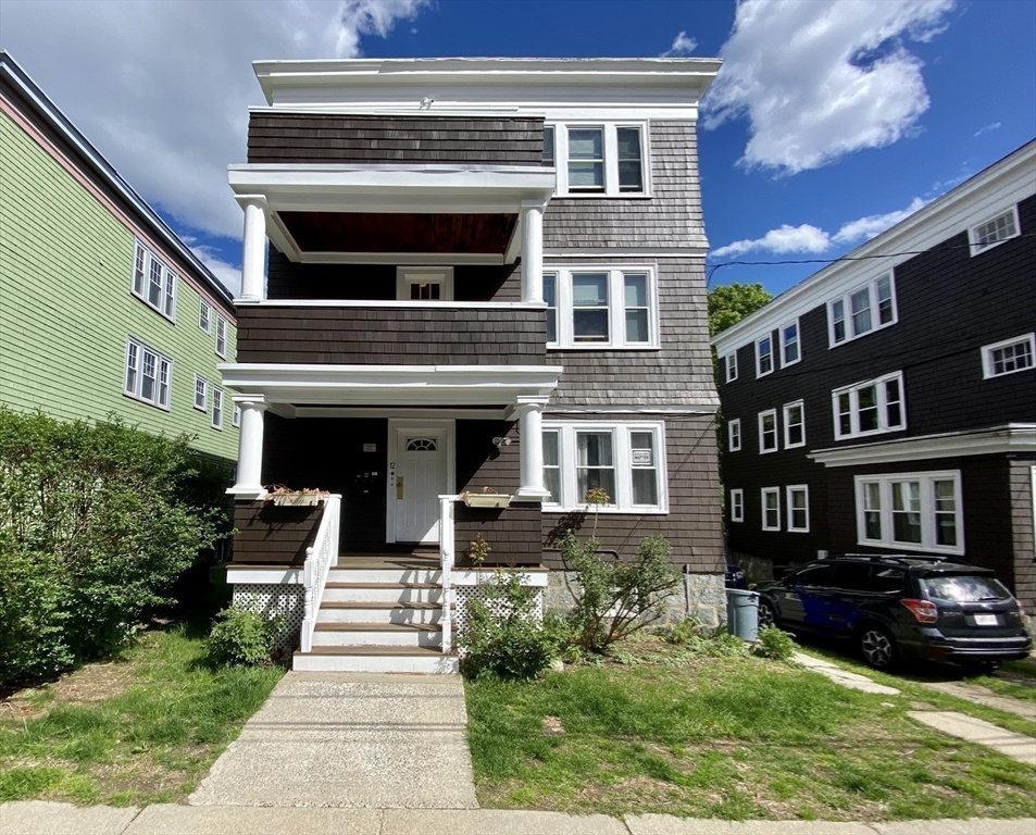 12 St Peter Street, Unit 1 Boston, MA 02130 - Photo 20 of 20 a front view of a house with a yard